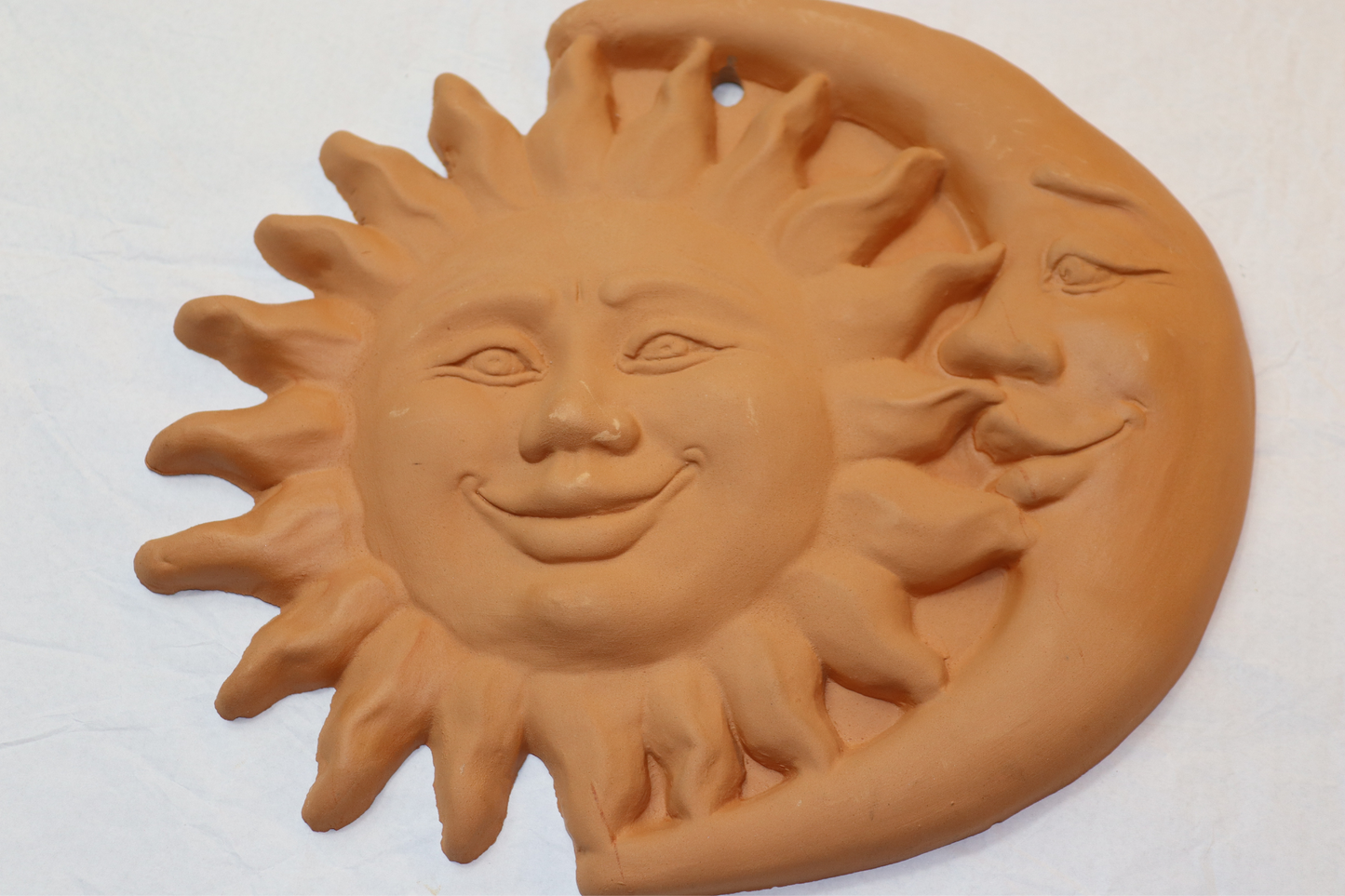 Sun and Moon in terracotta to hang on the wall